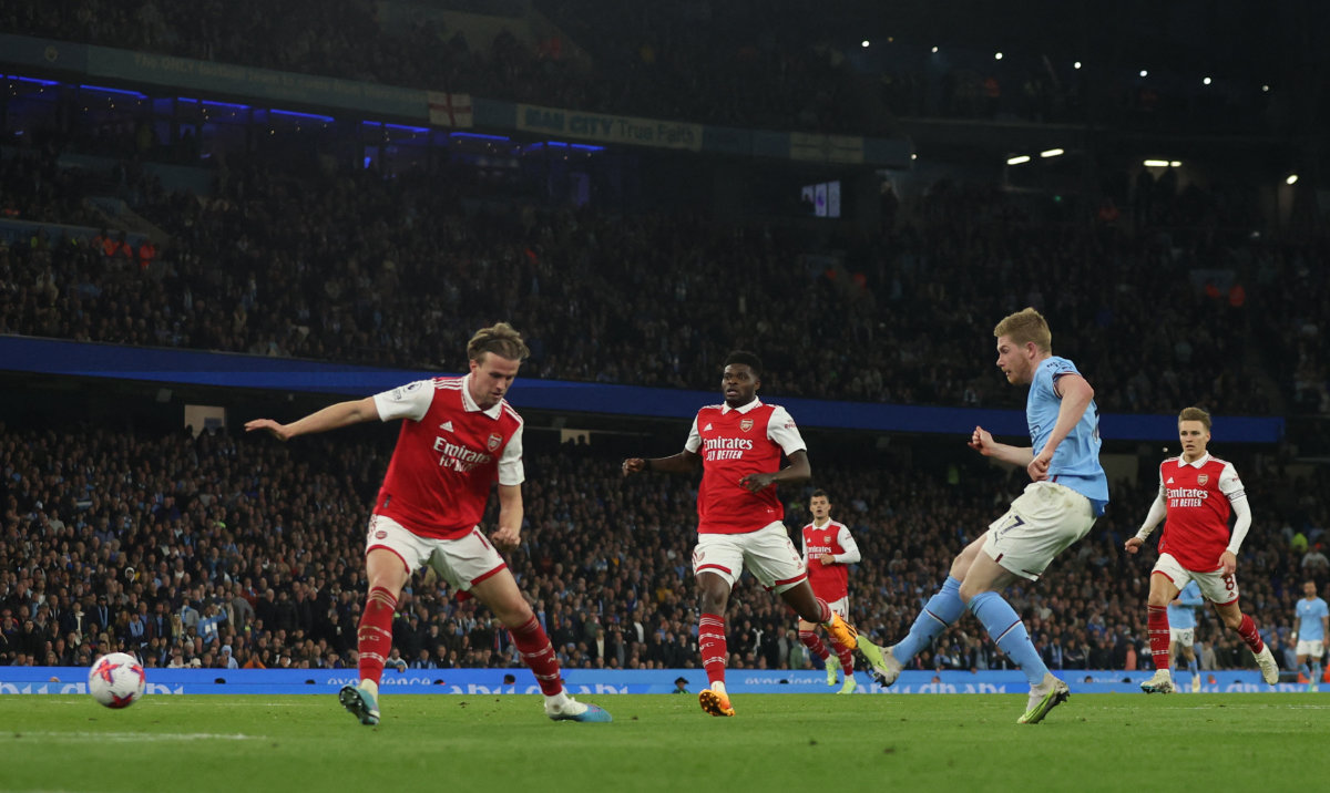 Manchester City's Kevin De Bruyne scores their third goal during the Premier League match Wednesday against Arsenal at Etihad Stadium, Manchester. (Reuters)