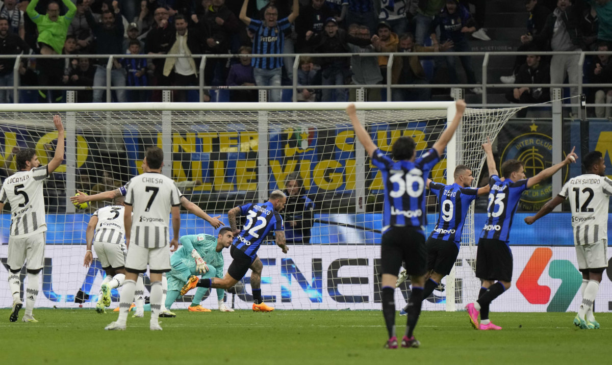 Inter Milan's Federico Dimarco (32) scores his side's opening goal during an Italian Cup semifinal second leg between Inter Milan and Juventus at the San Siro stadium in Milan Wednesday. (AP)