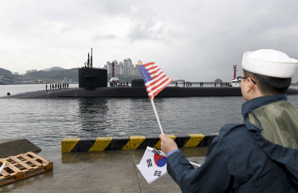 Above, the Ohio-class guided-missile submarine USS Michigan being greeted on April 25, 2017 as it arrives in Busan, South Korea for a scheduled port visit while conducting routine patrols throughout the western Pacific. (US Navy/AFP)