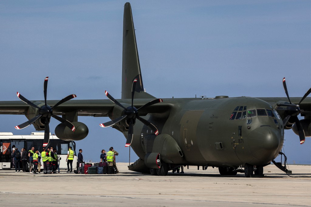 A British Royal Air Force C-130 Hercules military transport that was carrying evacuees from Sudan is pictured on the tarmac at Larnaca International Airport in Cyprus (AFP)