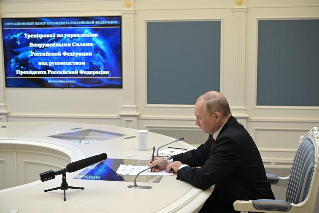 Russian president Vladimir Putin oversees the training of the strategic deterrence forces, troops responsible for responding to threats of nuclear war, via a video link in Moscow on Oct. 26, 2022. (Sputnik/AFP)
