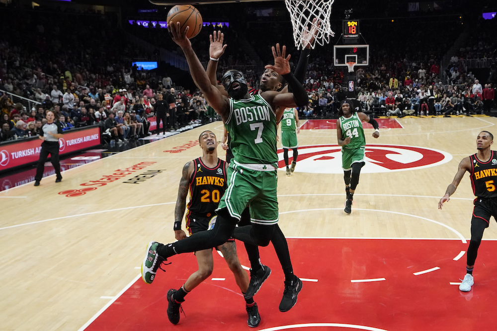 Boston Celtics' Jaylen Brown shoots and scores against Atlanta Hawks' Onyeka Okongwu during the second half of Game 6 of a first-round NBA basketball playoff series Thursday in Atlanta. (AP)