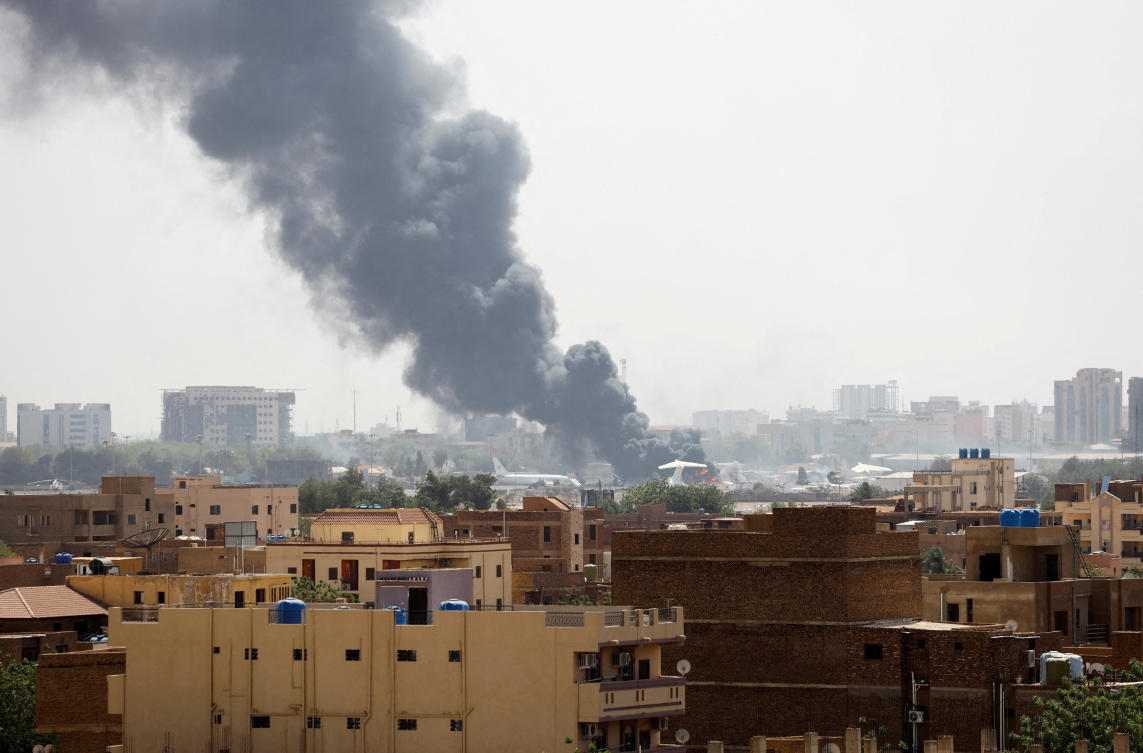 Smoke rises from burning aircraft inside Khartoum Airport during clashes between the paramilitary Rapid Support Forces and the army in Khartoum. (File/Reuters)
