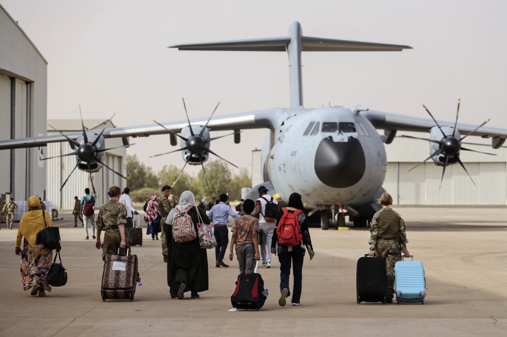 British Nationals boarding an RAF aircraft in Sudan, for evacuation to Larnaca International Airport in Cyprus (AFP)