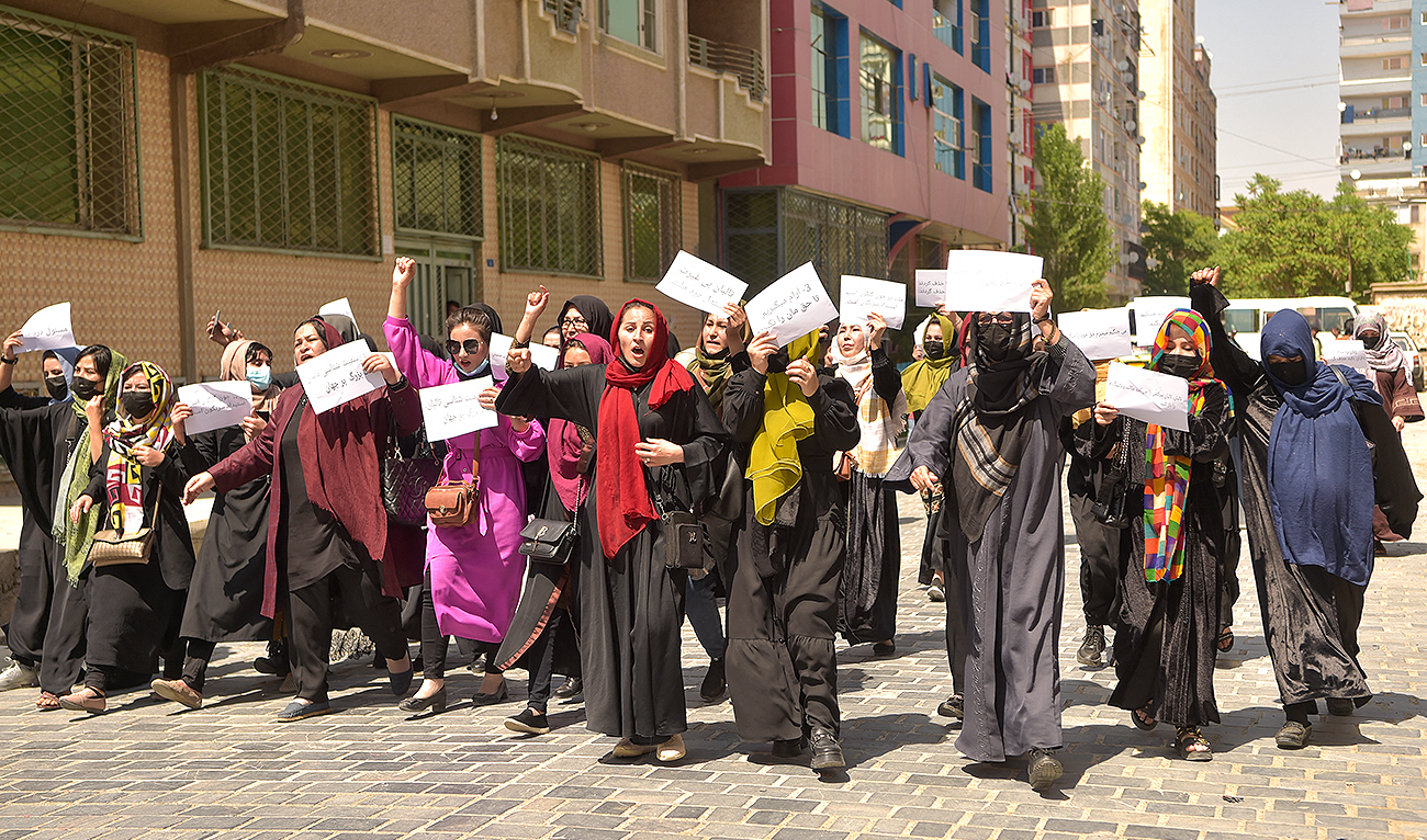 Afghan women hold placards as they march to protest for their rights, in Kabul on April 29, 2023. (Photo courtesy: AFP)