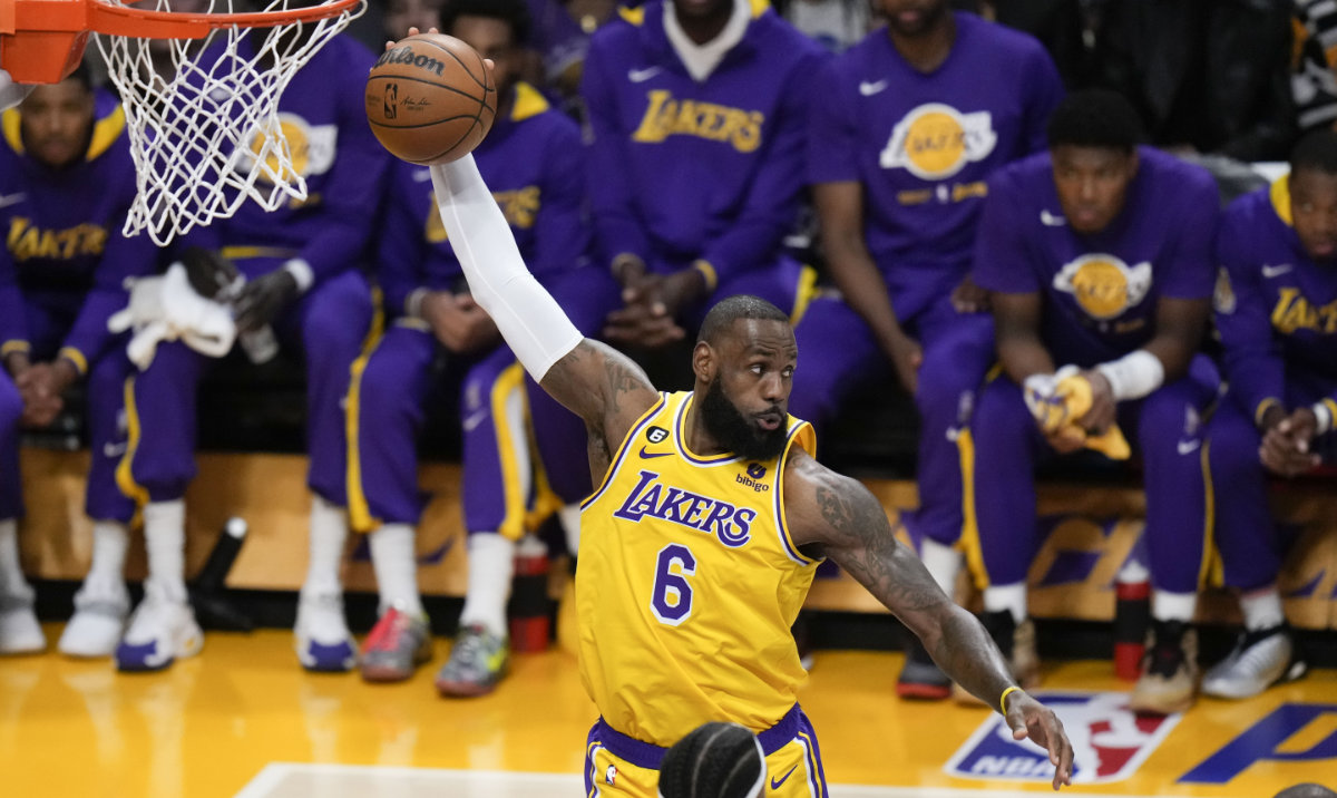 Los Angeles Lakers' LeBron James grabs a rebound during the first half in Game 6 of the team's first-round NBA basketball playoff series against the Memphis Grizzlies on Friday, April 28, 2023, in Los Angeles. (AP)