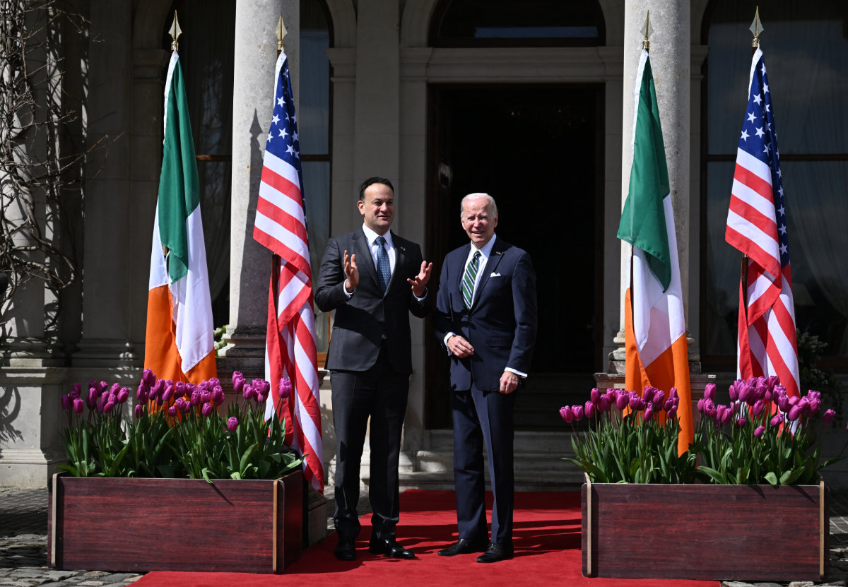 US President Joe Biden (R) is welcomed by Ireland's Prime Minister Leo Varadkar in Dublin on April 13, 2023. (AFP)