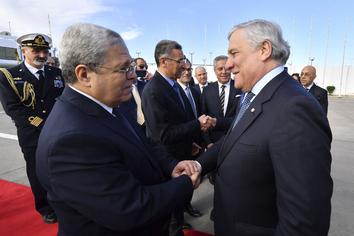Italian FM Antonio Tajani (R) is welcomed by Tunisian FM Othman Jirandi in Tunis on Jan. 18, 2023. (AFP file)
