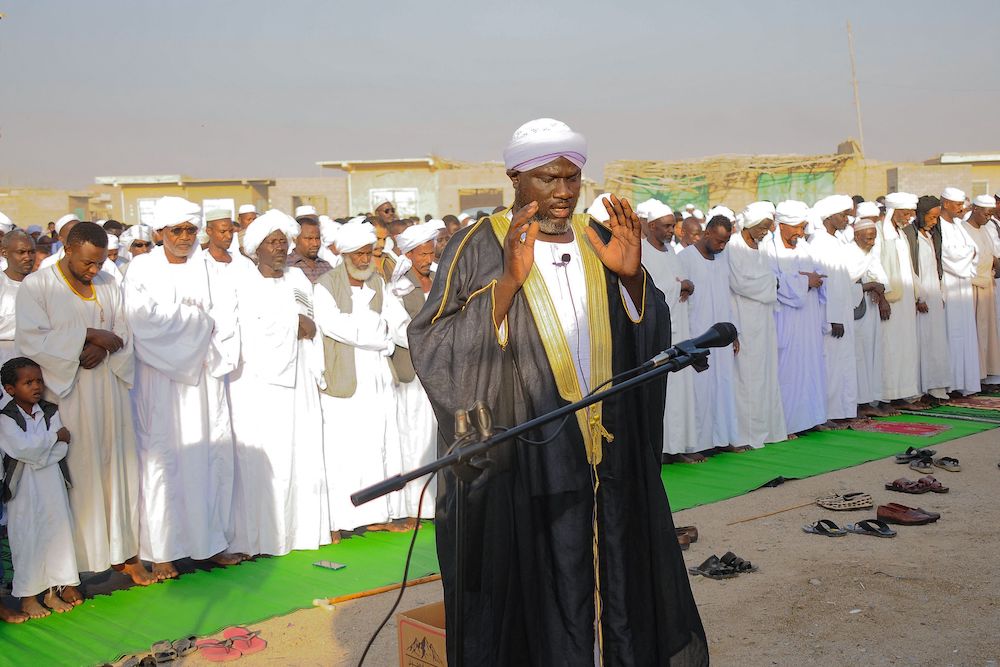A cleric guides the prayers in Port Sudan on April 21, 2023. (AFP)
