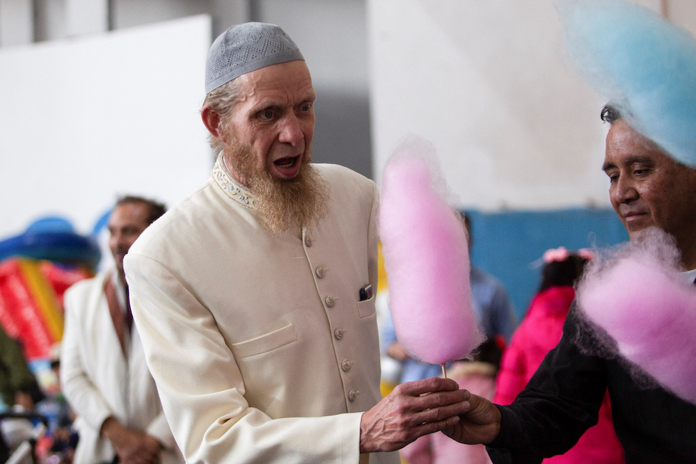 Muslim of Mexico’s Islamic community receives a cotton candy during Eid Al-Fitr celebrations in Mexico City, Mexico April 21, 2023. (Reuters)