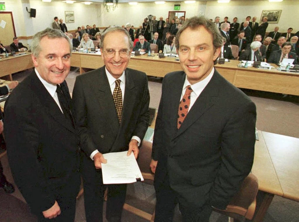 Irish PM Bertie Ahern, US Senator George Mitchell, & British PM Tony Blair after signing the Good Friday Agreement in 1998 (AFP)