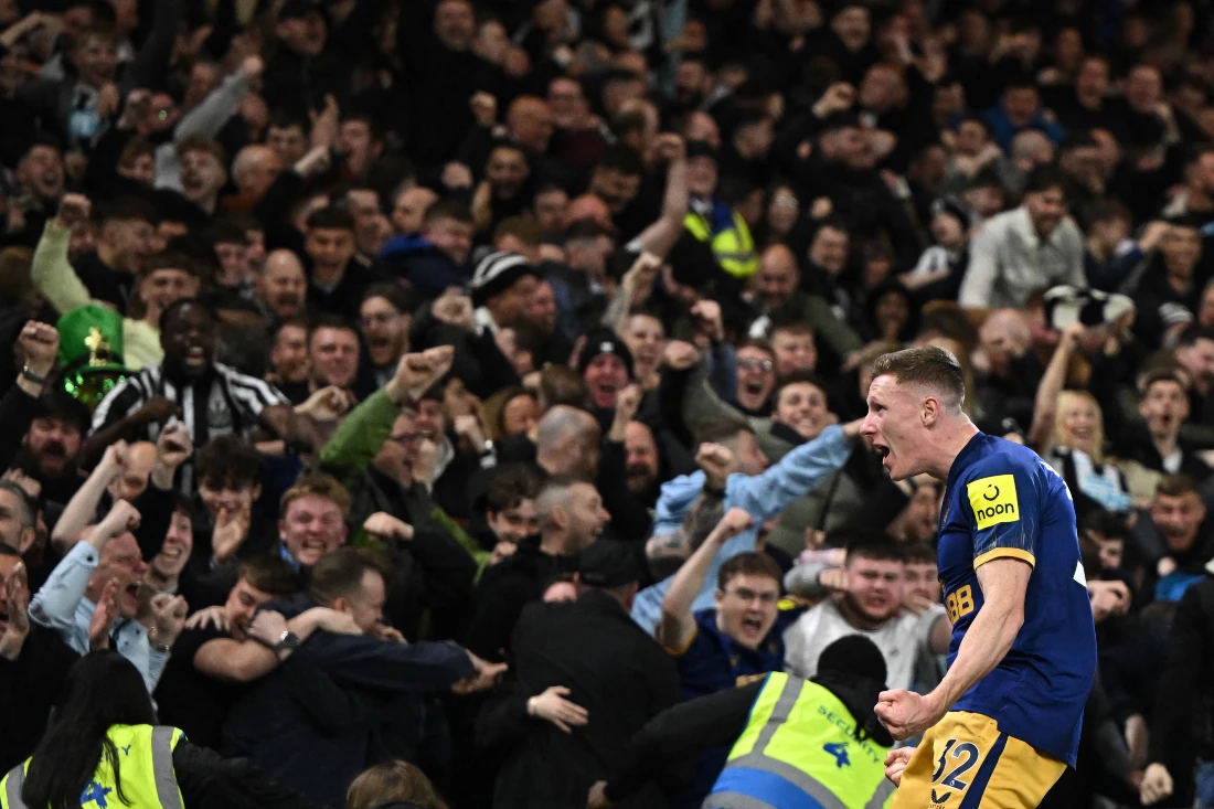 Newcastle United's English midfielder Elliot Anderson celebrates with supporters after scoring Newcastle's second goal during the English Premier League football match between Nottingham Forest and Newcastle United. (File/AFP)