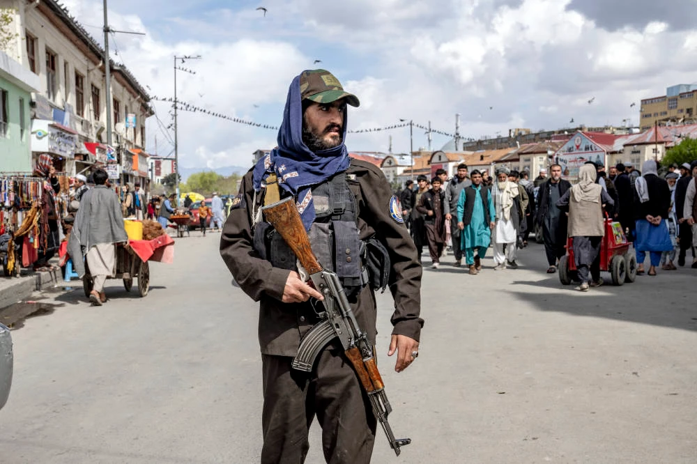 A Taliban fighter stands guard as worshippers attend Friday prayer during the Muslim holy fasting month of Ramadan, in Kabul, Afghanistan, Friday, March 31, 2023. (AP)