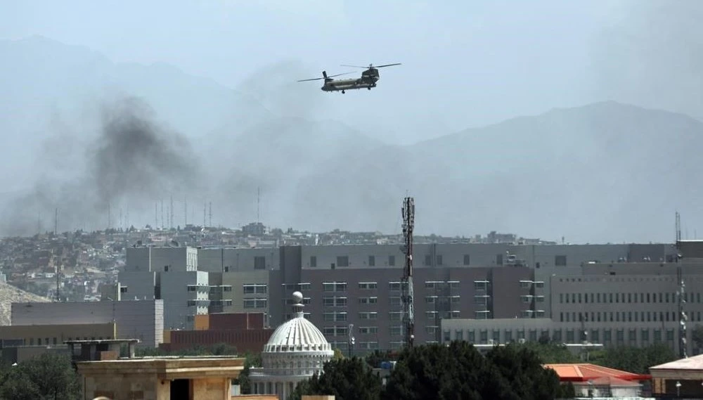 A Chinook heavy-lift helicopter flies over the city of Kabul, Afghanistan, Aug. 15, 2021. (AP Photo)