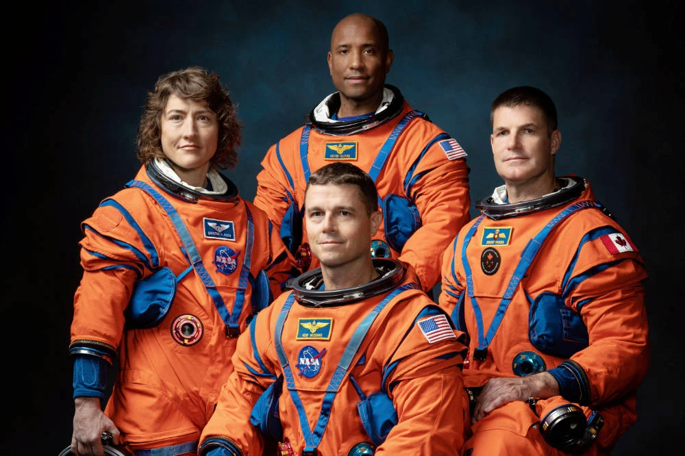 NASA Astronauts Christina Koch, Victor Glover, Reid Wiseman and Canadian Space Agency Astronaut Jeremy Hansen, the four-member team chosen for the Artemis II lunar flyby, pose wearing flight suits in Houston, Texas, U.S. March 30, 2023. (REUTERS)
