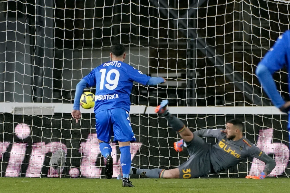 Empoli's Francesco Caputo scores to 1-0 during the Serie A soccer match between Empoli FC and US Lecce at the Castellani stadium in Empoli, Italy, Monday. (AP)