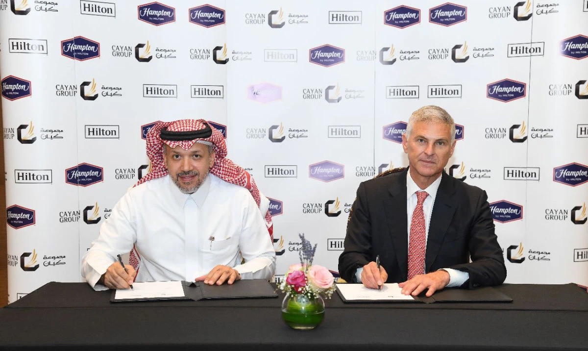Ahmed M. Alhatti, chairman — Cayan Group, and Christopher J. Nassetta, president and CEO — Hilton Worldwide, at the signing ceremony.