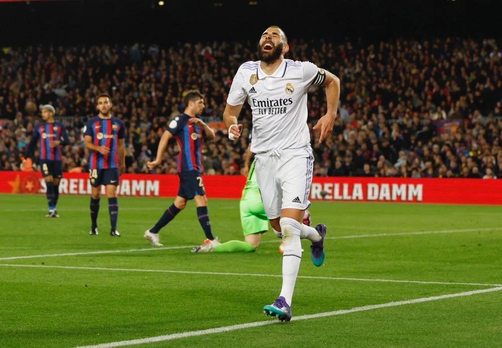 Real Madrid’s Karim Benzema celebrates scoring their fourth goal to complete his hat-trick. (Reuters)