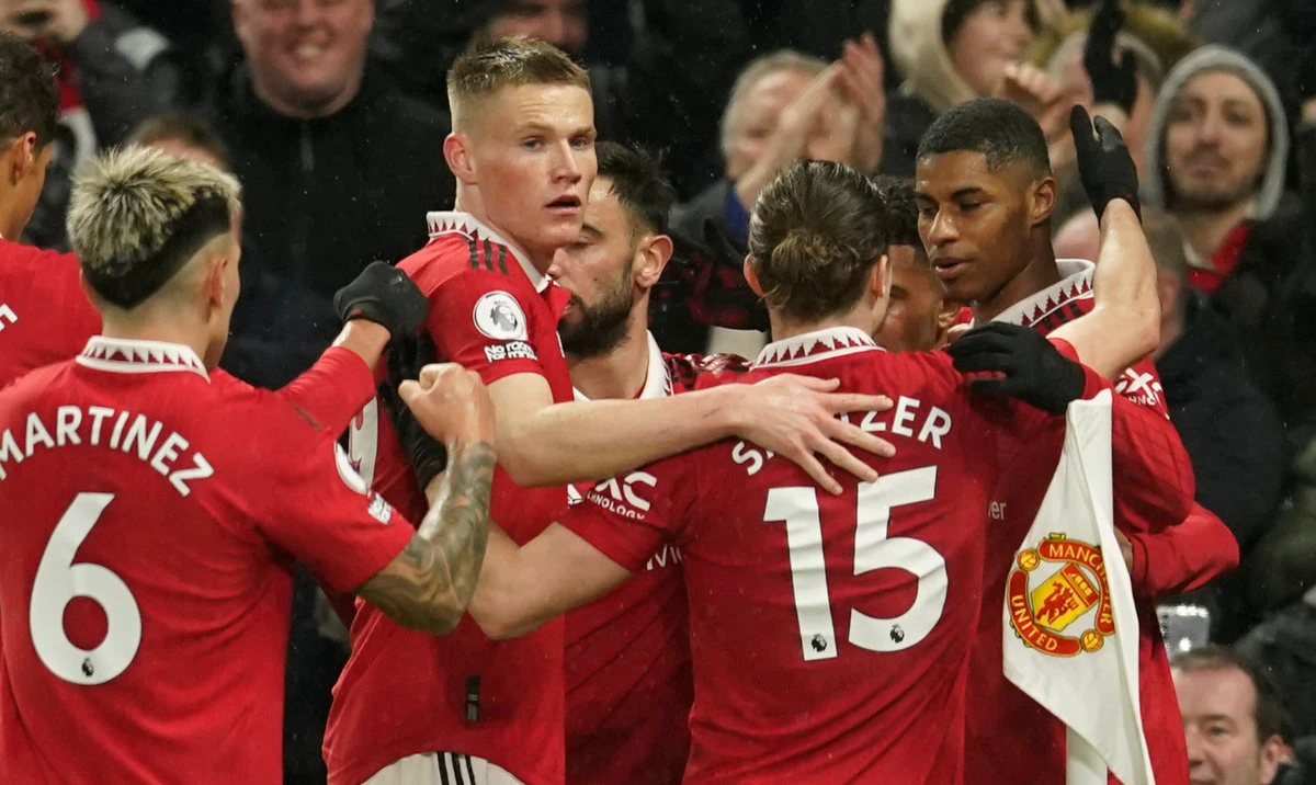 Manchester United's Marcus Rashford, right, celebrates with his teammates after scoring his side's first goal during the English Premier League soccer match against Brentford, at the Old Trafford stadium in Manchester Wednesday. (AP)