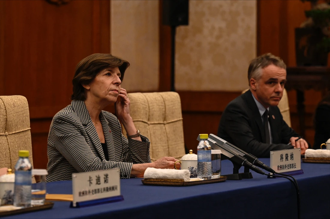 French Foreign Minister Catherine Colonna (L) listens to Chinese Foreign Minister Qin Gang (not pictured) during their meeting in the Diaoyutai State Guesthouse in Beijing. (AFP)