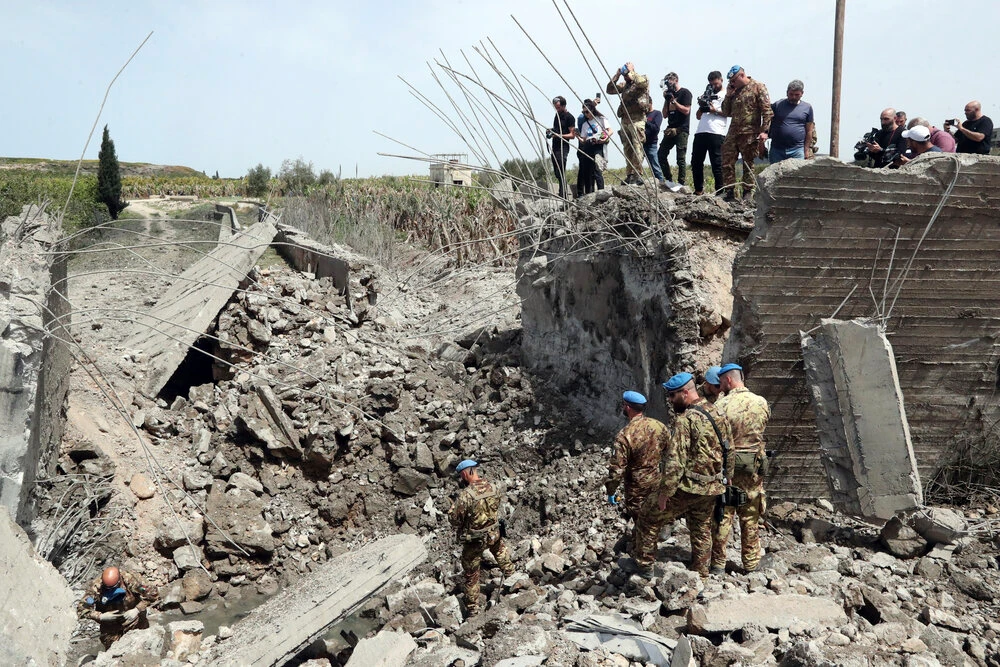 Italian UN peacekeeper soldiers inspect a small bridge that was destroyed by an Israeli airstrike, in Maaliya village, south Lebanon, on Apr. 7, 2023. (AP)