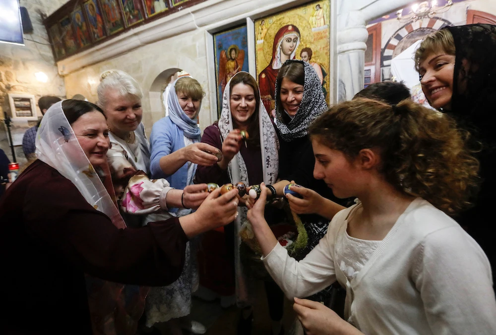 Egg tapping is an Easter tradition in Lebanon but competition may be scarce this year with a box of eggs costing 500,000 Lebanese pounds. (AFP)