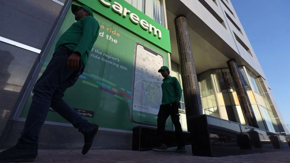 Careem employees walk past the company headquarters in Dubai, UAE, on December 13, 2018. (REUTERS/File)