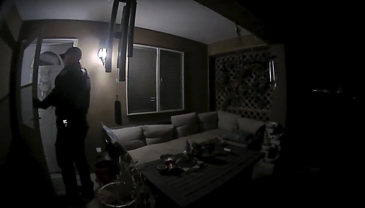In this image taken from body camera video provided by the Farmington Police Department, a police officer knocks on the door of the wrong address in response to a domestic violence call, in Farmington, N.M., late April 5, 2023. Moments later, the homeowner was fatally shot by police after appearing at the door armed with a handgun. (AP)