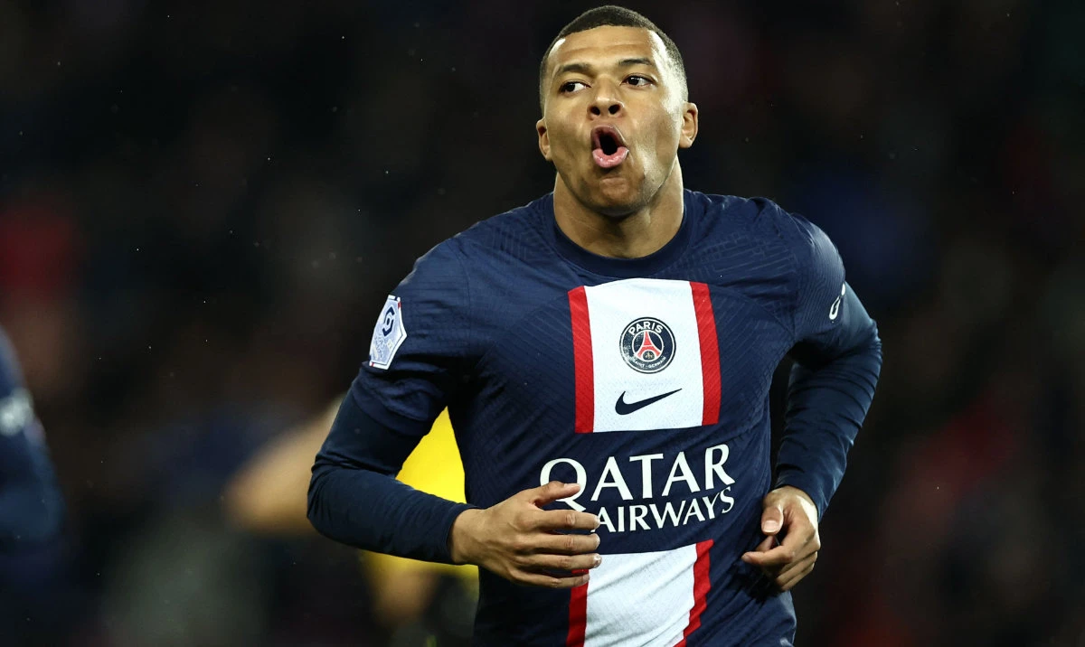 Paris Saint-Germain's French forward Kylian Mbappe celebrates after scoring his team's first goal during the French L1 football match between Paris Saint-Germain (PSG) and Lens (RCL) at the Parc des Princes in Paris, on April 15, 2023. (AFP)