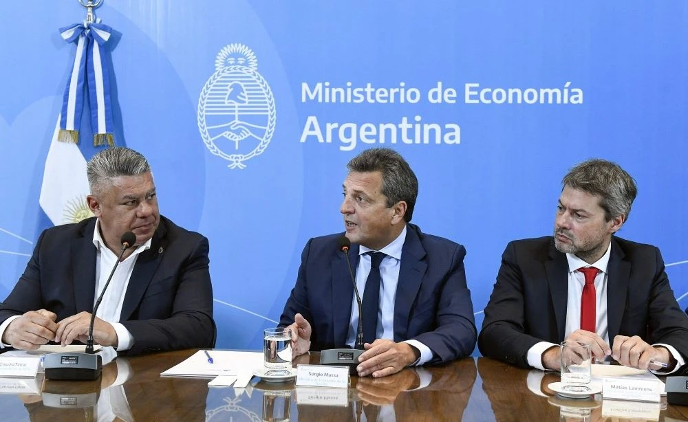 Argentine FA President Claudio Tapia, left, Economy Minister Sergio Massa, center, and Tourism & Sports Minister Matias Lammens announce the FIFA U-20 World Cup hosting. (Twitter/@Economia_Ar)