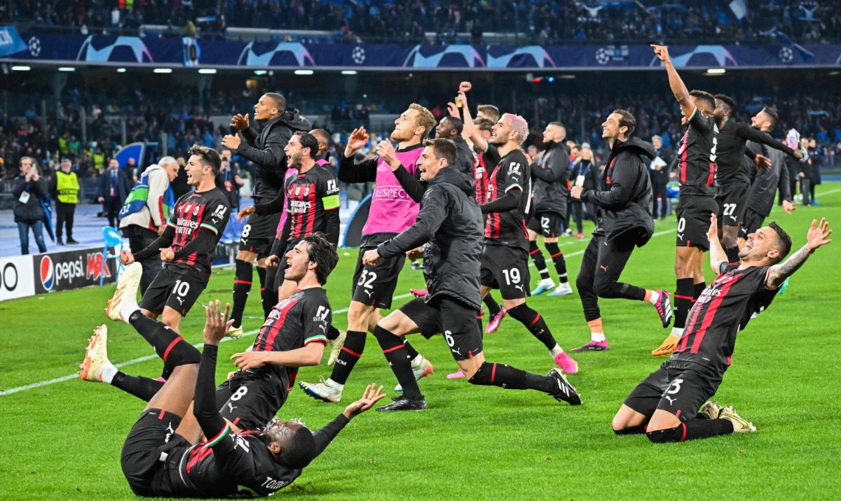 AC Milan players celebrate before the crowd at the end of the UEFA Champions League quarterfinals second against Napoli on Tuesday at the Diego Maradona stadium in Naples. (AFP)