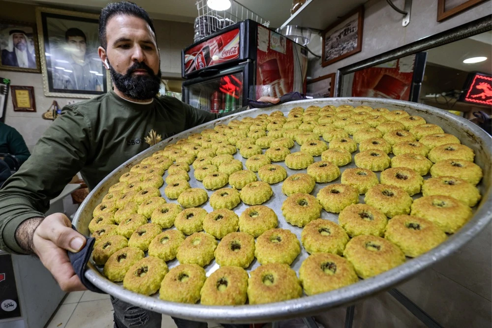 The iftar meal is a rare attempt at cross-community dialogue amid a spike in violence in the Palestinian territory. (AFP)