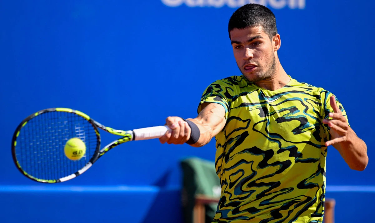 Spain’s Carlos Alcaraz returns the ball to Spain’s Roberto Bautista during their ATP Barcelona Open “Conde de Godo” tennis tournament singles match at the Real Club de Tenis in Barcelona on Thursday. (AFP)