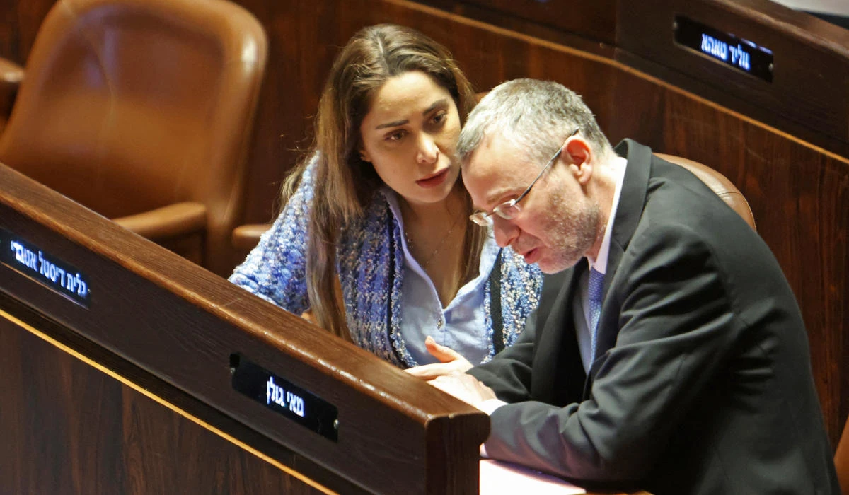 Israeli Justice Minister Yariv Levin (R) listens to MP May Golan during a session at the parliament, Knesset, in Jerusalem on March 20, 2023. (AFP)