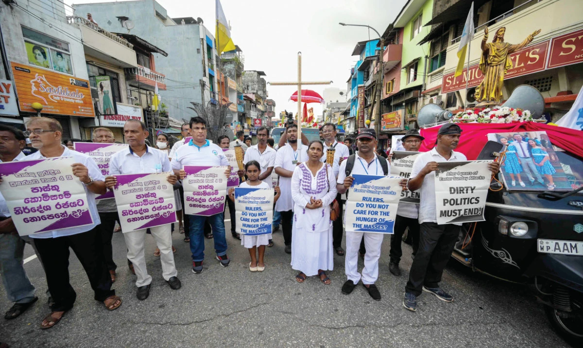 Sri Lankans demonstrate on the fourth anniversary of the Easter Sunday bombings, outside St. Anthony’s church in Colombo on Friday. (AFP)