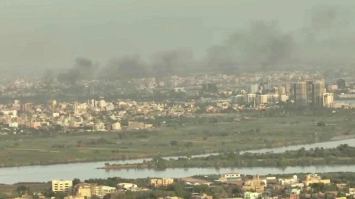 A drone view shows smoke rising over buildings a week after fighting began in north Khartoum, as seen from the twin city of Omdurman, Sudan, on April 22, 2023. (Reuters TV via REUTERS)