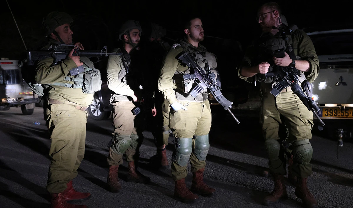 Israeli soldiers patrol Kibbutz Natur in the Israeli-annexed Golan Heights, April 9, 2023. (AFP/FILE)