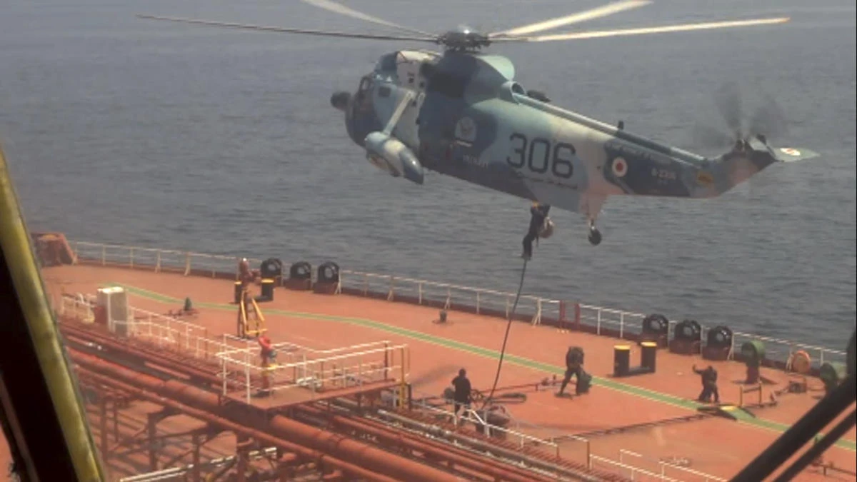 In this frame grab from video footage released Friday April 28, 2023 by the Iranian Navy, Iranian marines rappel onto the Advantage Sweet, a Marshall Islands-flagged oil tanker's deck in the Gulf of Oman. (Iranian Navy via AP)