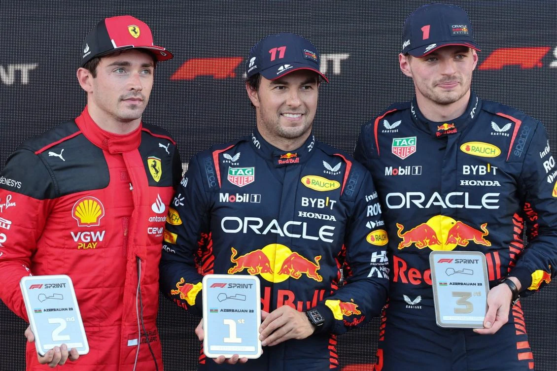 Winner Red Bull Racing’s Mexican driver Sergio Perez (C), second placed Ferrari’s Monegasque driver Charles Leclerc (L) and third placed Red Bull Racing’s Dutch driver Max Verstappen pose during a ceremony for the sprint race ahead of the Formula One Azerbaijan Grand Prix at the Baku City Circuit in Baku. (AFP)