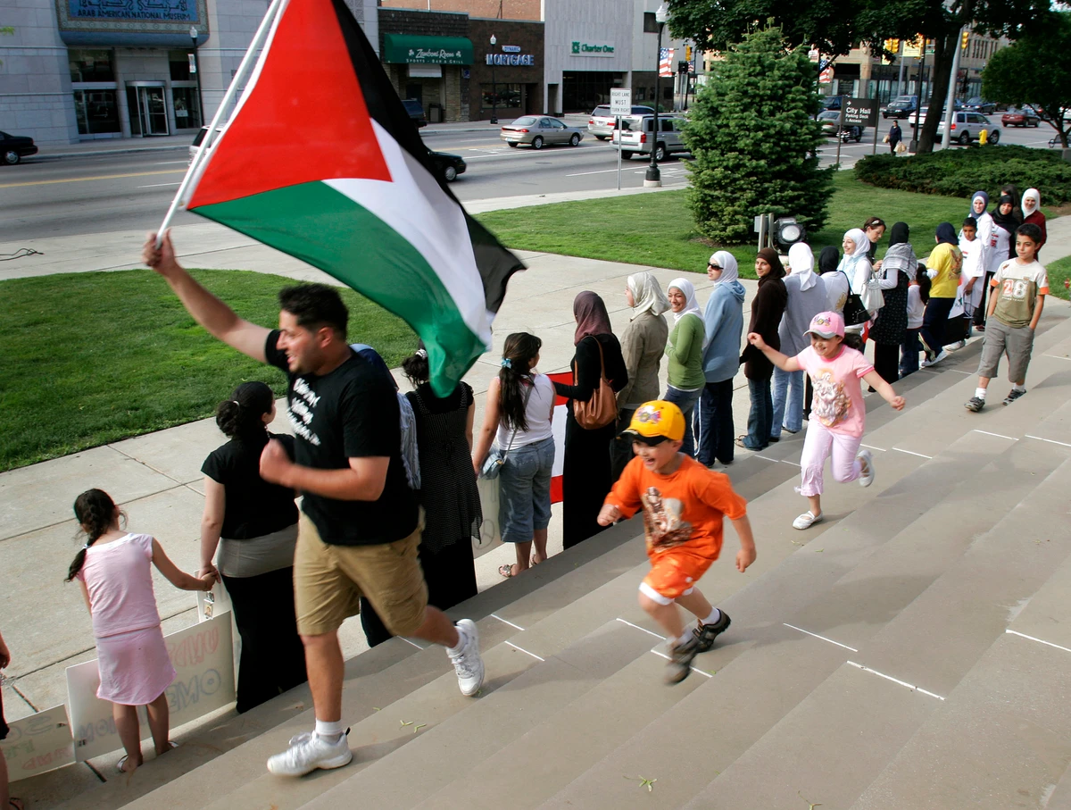 Arab-Americans join hands at a unity rally in front of Dearborn City Hall in Michigan. (Getty Images via AFP/File photo)