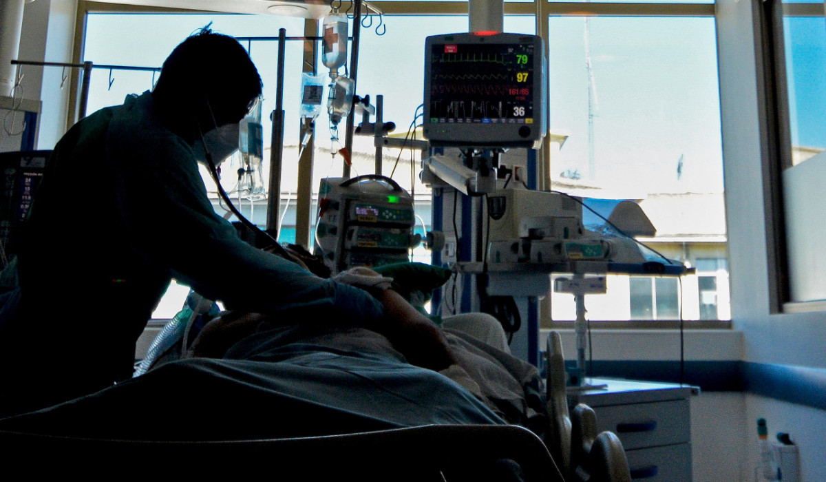 In this file photo taken on April 12, 2021, a nurse checks the intubation of a patient infected with COVID-19 at the Intensive Care Unit (UCI) of the Guillermo Grant Benavente Hospital in Concepcion, Chile. (AFP)