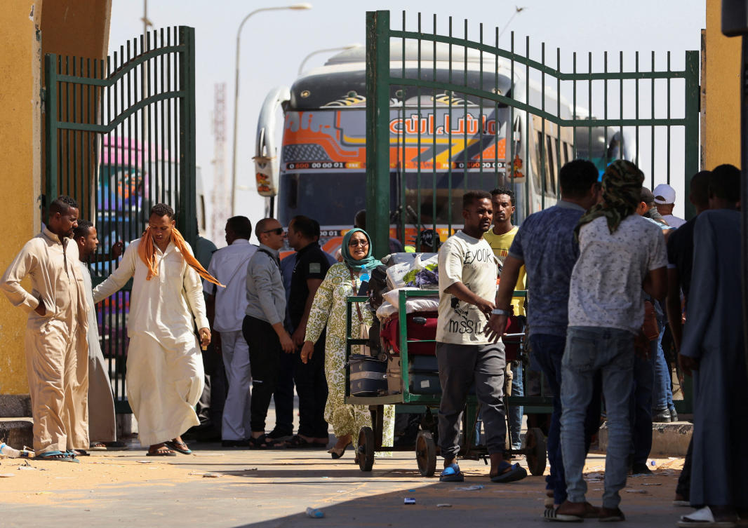 Civilians fleeing from fighting in Sudan arrive at the Argeen land port on the upper reaches of the Nile in Aswan, Egypt (Reuters)