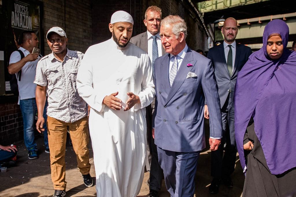 Britain’s King Charles and Imam Mohammed Mahmoud visit floral tributes left close to the scene of the Finsbury Mosque attack in Finsbury Park, north London. (File/AFP)