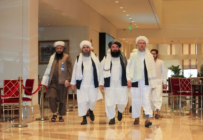 In this file photo, members of the Taliban negotiating team and the Taliban delegation makes their way for the Afghan peace talks in Doha, Qatar, on Aug. 12, 2021. (AFP/File)