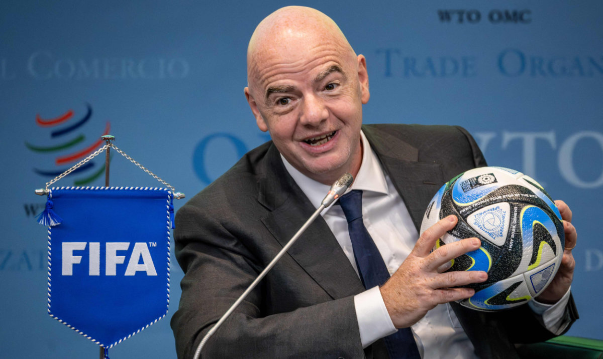 FIFA President Gianni Infantino holds an official ball of the 2023 FIFA Women’s World Cup during the ‘Making trade score for women!’ discussion on the use of football as a tool for trade and development at the WTO headquarters in Geneva, on Monday. (AFP)