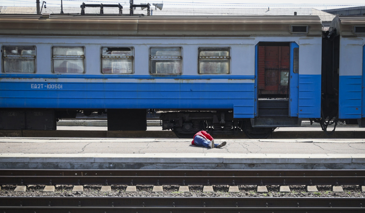 A casualty lies on the platform in the aftermath of a rocket attack on the railway station in the eastern city of Kramatorsk, in the Donbass region on April 8, 2022. (AFP)