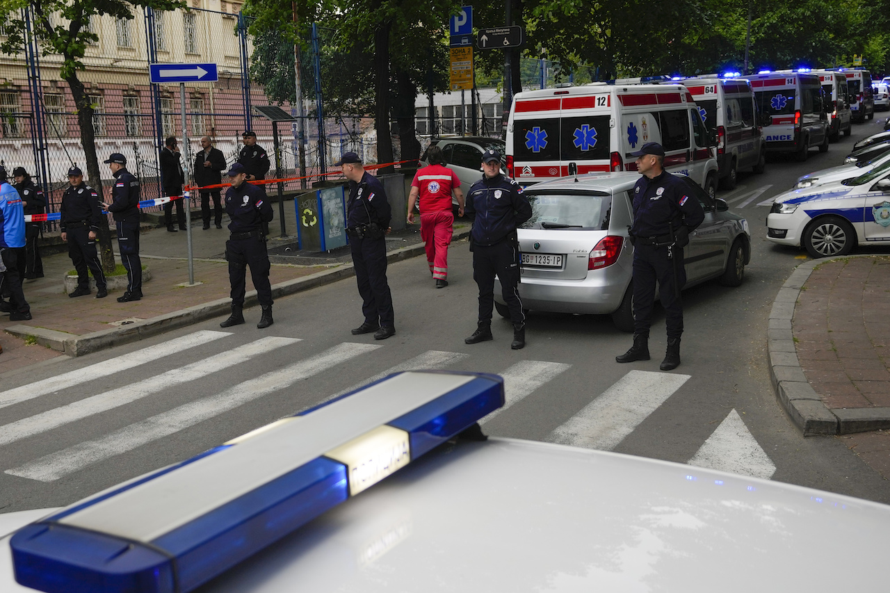 Police officers block the street around the Vladislav Ribnikar school in the very center of Belgrade, Serbia, Wednesday, May 3, 2023. (AP)
