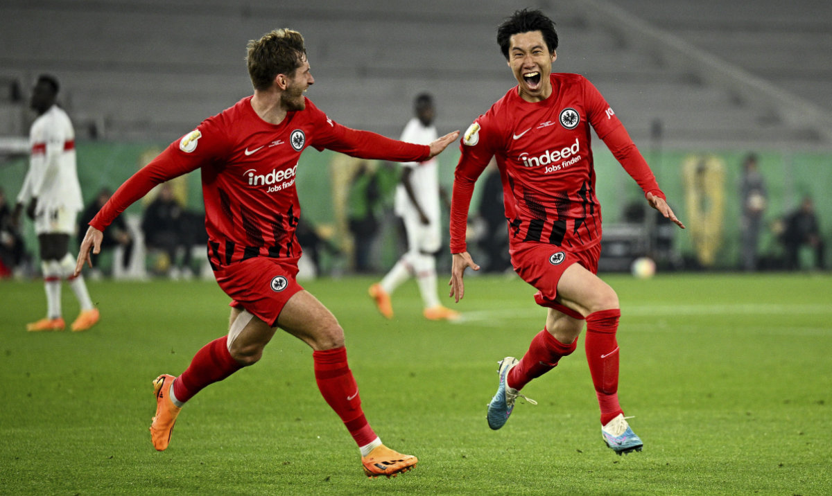 Frankfurt's Daichi Kamada celebrates his goal with Christopher Lenz during a German Soccer Cup semi-final match between VfB Stuttgart and Eintracht Frankfurt at Mercedes-Benz Arena, Stuttgart, Germany, May 3, 2023. (AP)
