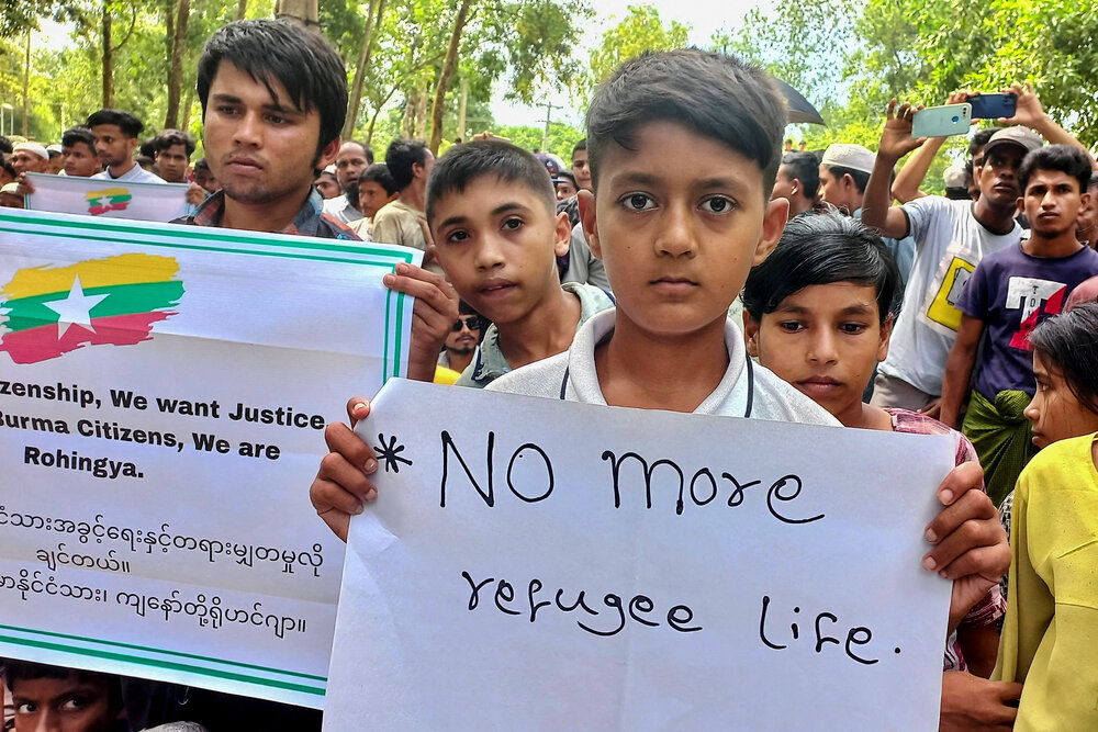 Rohingya refugee children hold placards as they gather at the Kutupalong Refugee Camp to mark the fifth anniversary of their fleeing from neighboring Myanmar to escape a military crackdown in 2017, in Cox’s Bazar on Aug. 25, 2022. (Reuters/File)