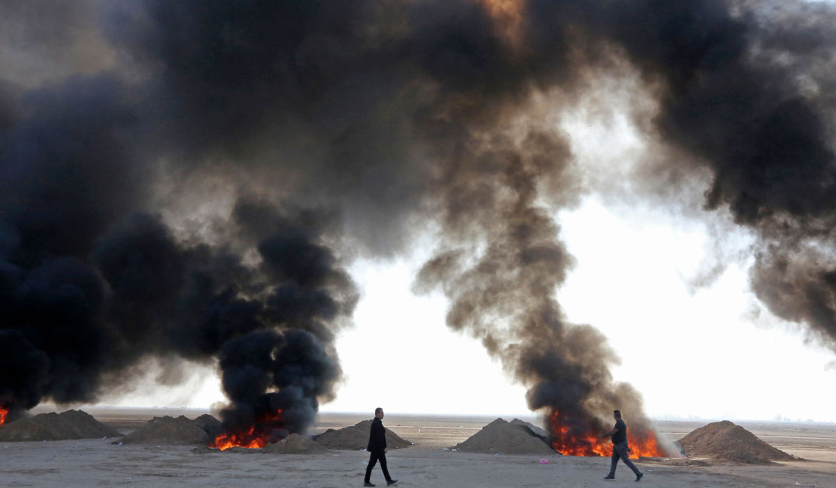 Iraqi government officials destroy nearly six tons of drugs, some of which had been in storage for more than a decade, in Baghdad's Nahrawan area on December 18, 2022. (AFP)